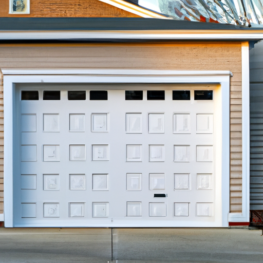 Suburban Cambridge garage exterior with modern garage door and visible hardware, brick house, tidy driveway.